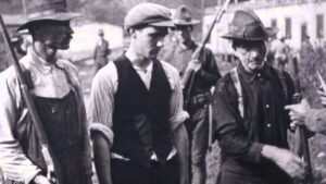 Miners standing in line to get their weapons