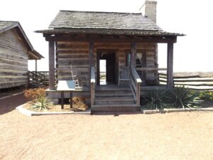 Susan Godsey and the Sleeping Beauty's Cabin donated to Discovery Park of America by the Eddie Hicks family of Fulton, Tennessee.
