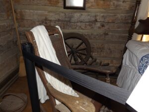 Chair and Spinning wheel inside the Sleeping Beauty's Cabin.  Discovery Park of America